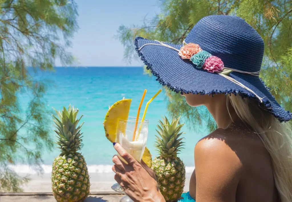 woman drinking cocktail beach bar (1)