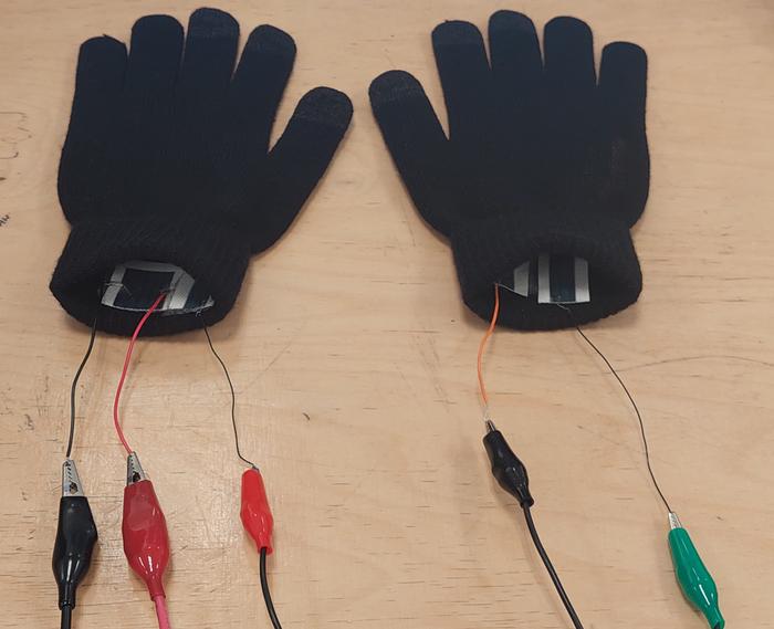 low res gloves with swatches of e textile attached and wired for sensing testing credit marzia dulal